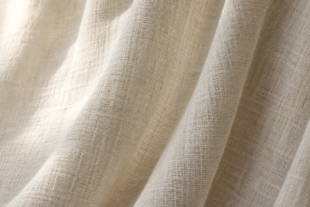 Design inspiration: close-up of ivory linen curtain fabric